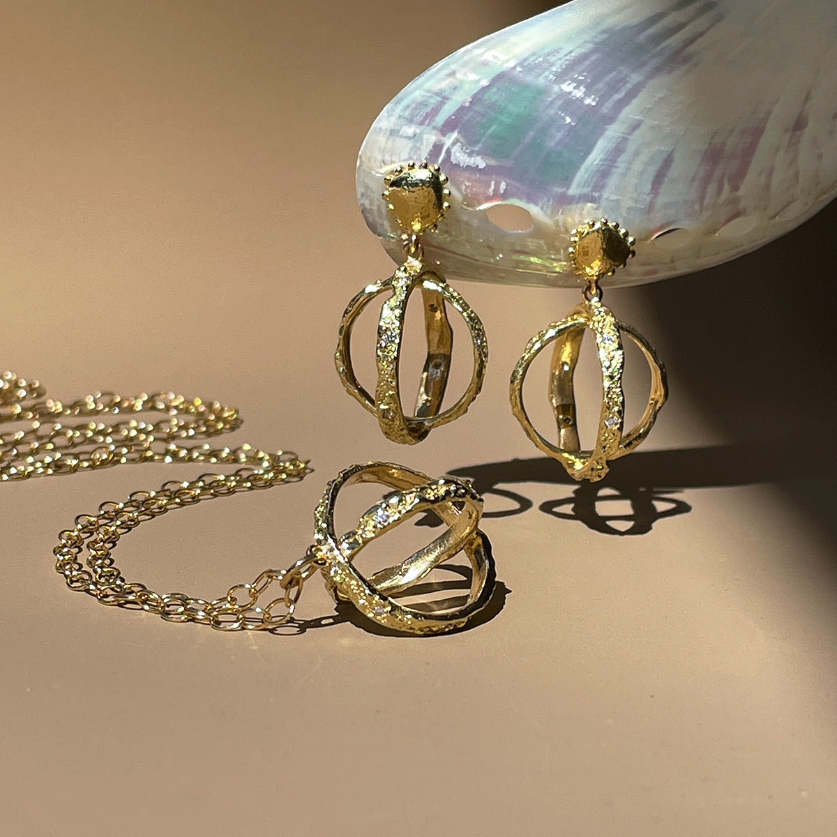 Gold and diamond textured orb necklace and earring set by Jane Bartel Jewelry. Ocean inspired handcrafted fine jewelry.
