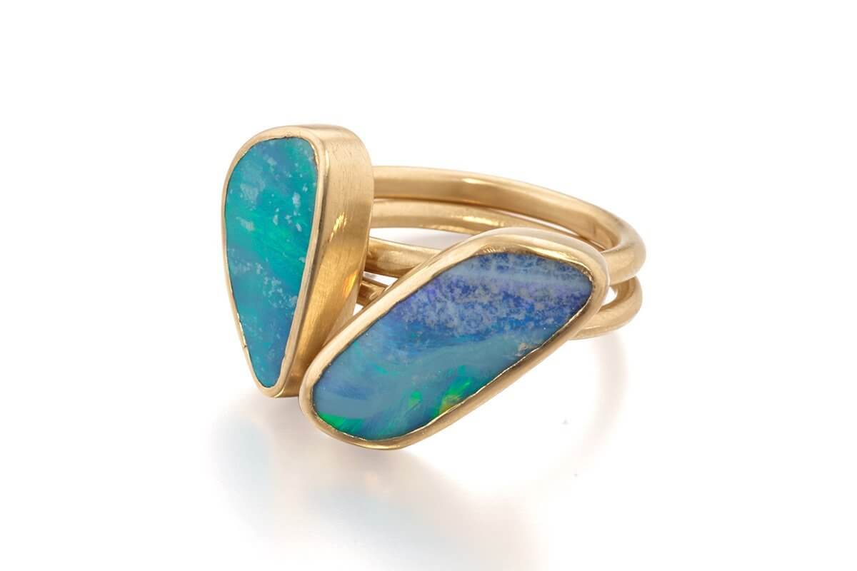 Opal birthstone jewelry for October babies by Jane Bartel Jewelry. Learn about the history and symbolism of gold opal jewelry