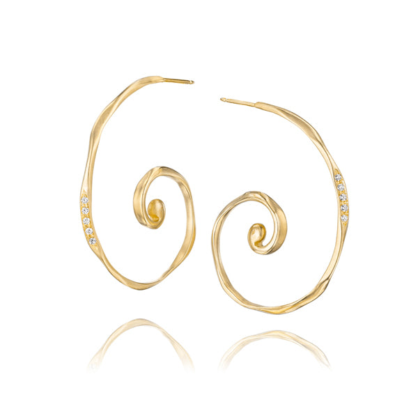 Spiral gold hoop earrings set with white diamonds are inspired by the waves in the ocean. Handcrafted with ethically sourced recycled gold and recycled diamonds in by Jane Bartel Jewelry. Handcrafted fine ocean inspired jewelry.