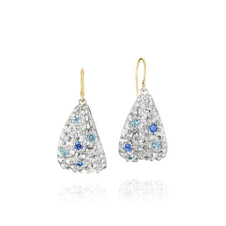 Sterling silver dangle earrings are set with sapphires and topaz gemstones