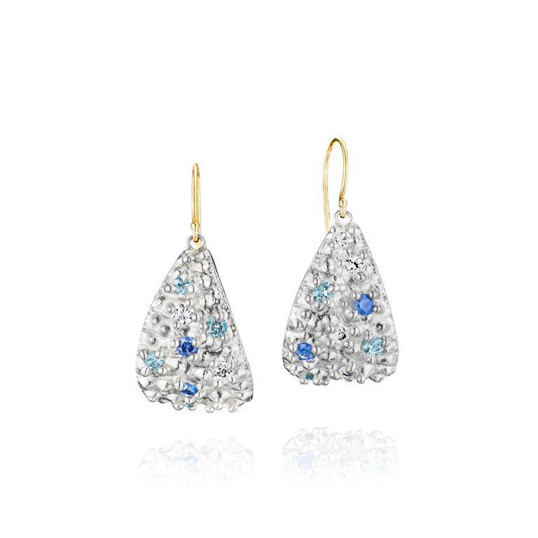 Sterling silver dangle earrings are set with sapphires and topaz gemstones