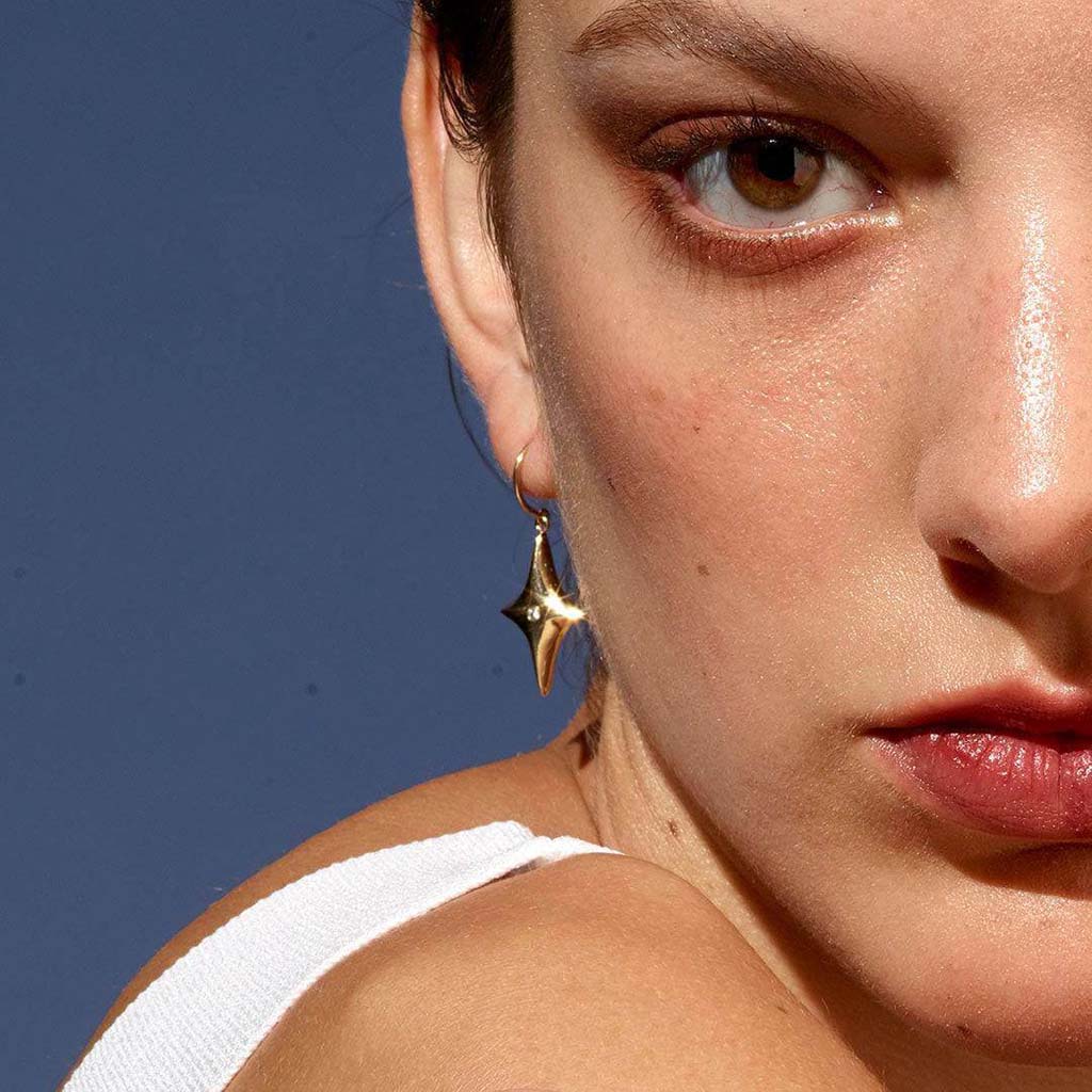 14k gold star diamond dangle earrings by Jane Bartel Jewelry