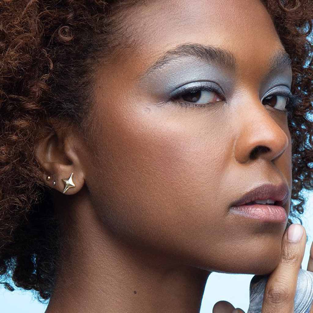 14k gold and diamond star stud earrings by Jane Bartel