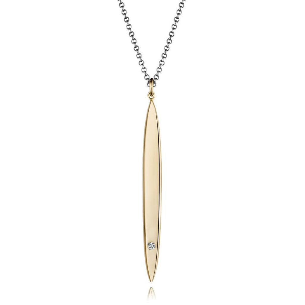 Modern gold surfboard necklace in 14k gold with a white diamond by Jane Bartel